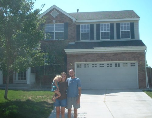 The Donnelys in front of their house