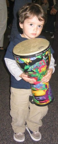 Sean putting his drum back at Remo's Kid's Rhythm Club