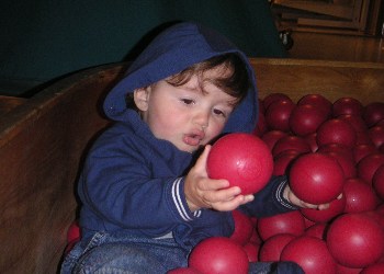 Sean enjoying the ball pool at Ikea