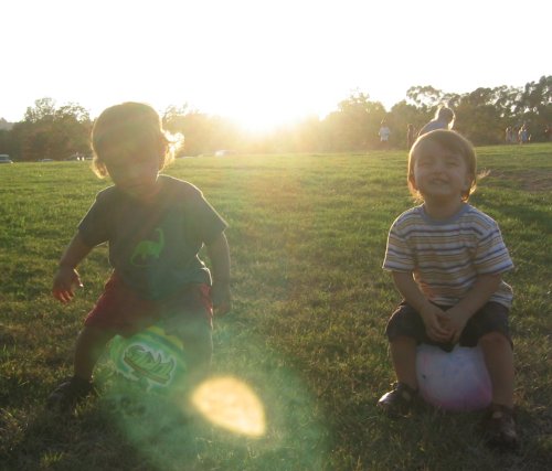 Sean and Xander playing with balls at the Autry